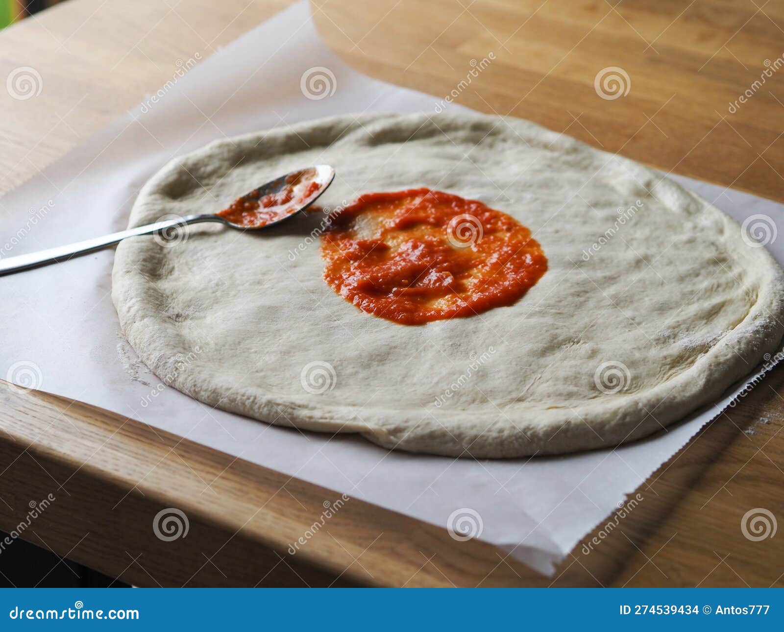 Raw Pizza Dough. Applying the Sauce Stock Photo Image of baking