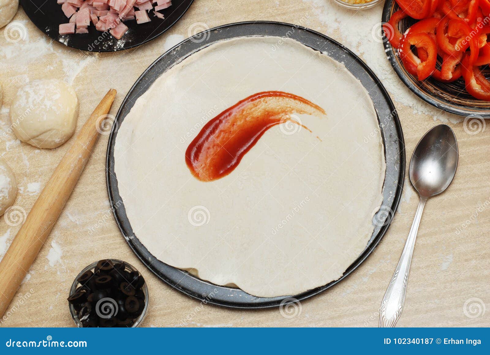 Raw Pizza Dough With Sauce And Ingredients On Wooden Table ...