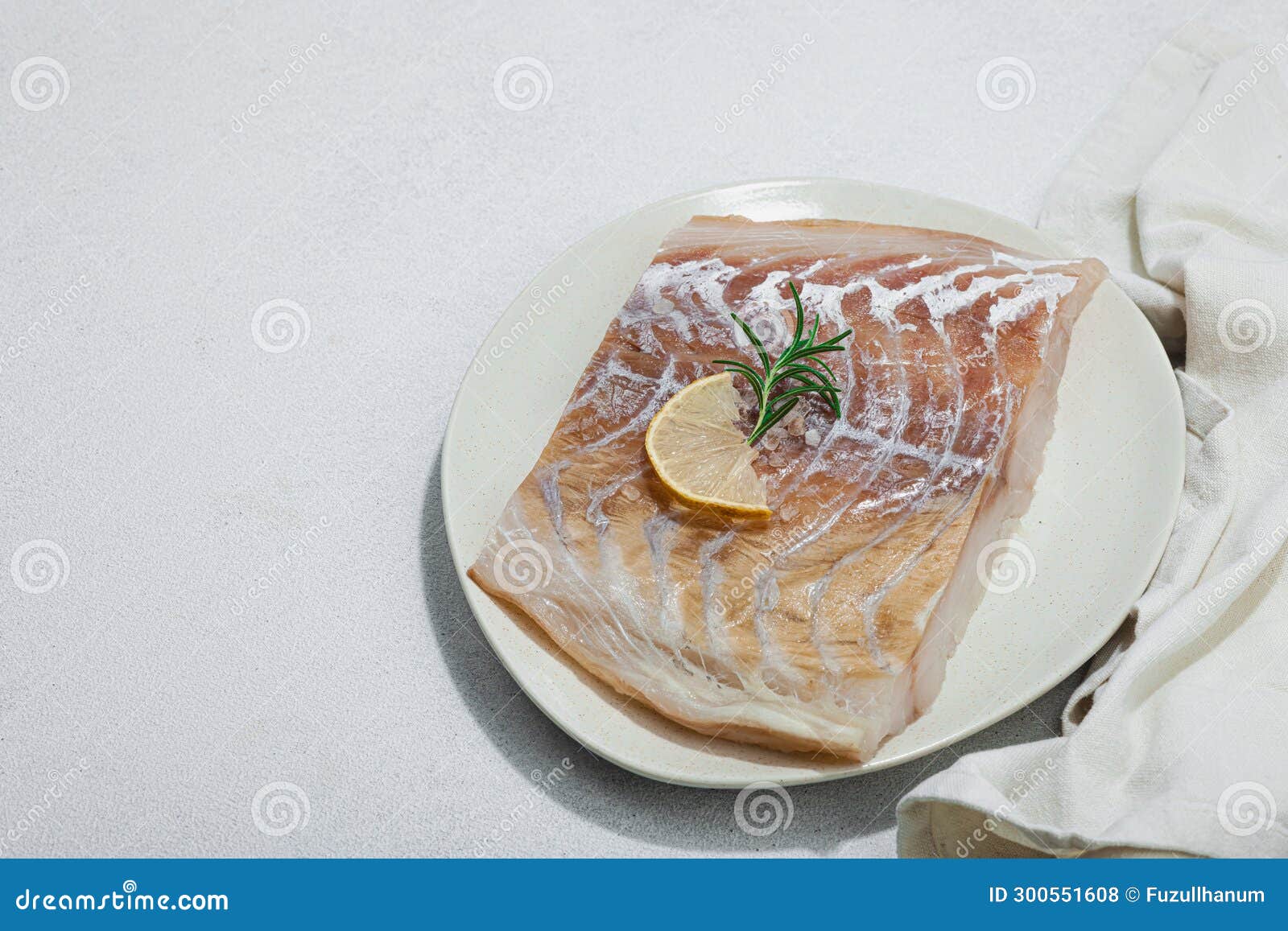 raw pollock (pollachius virens) fillet. fresh fish for healthy food lifestyle. spices and herbs