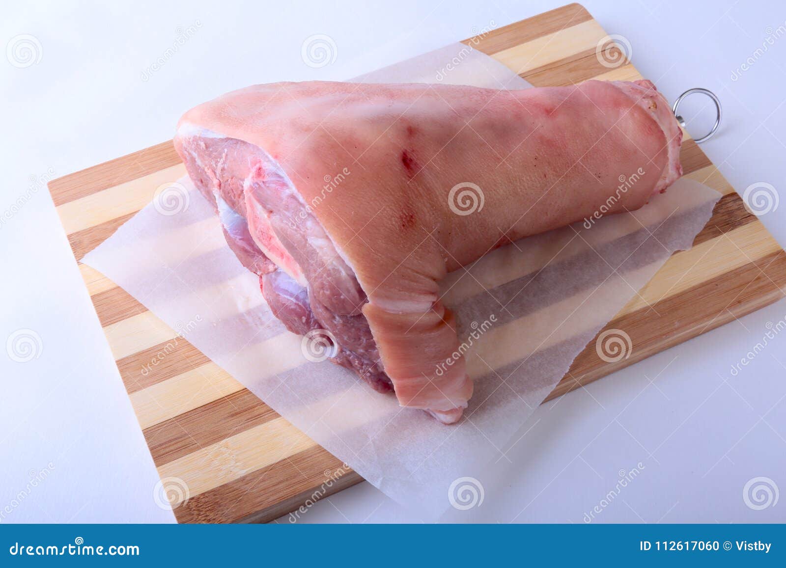 Raw Pork Knuckle on a Cutting Board. Selective Focus. Ready for Cooking