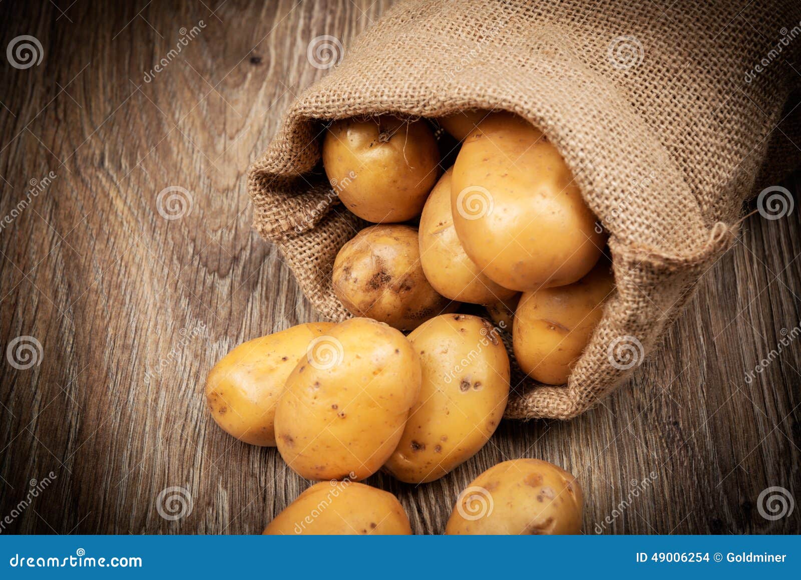 Raw potatoes in the sack stock photo. Image of nutritious 49006254