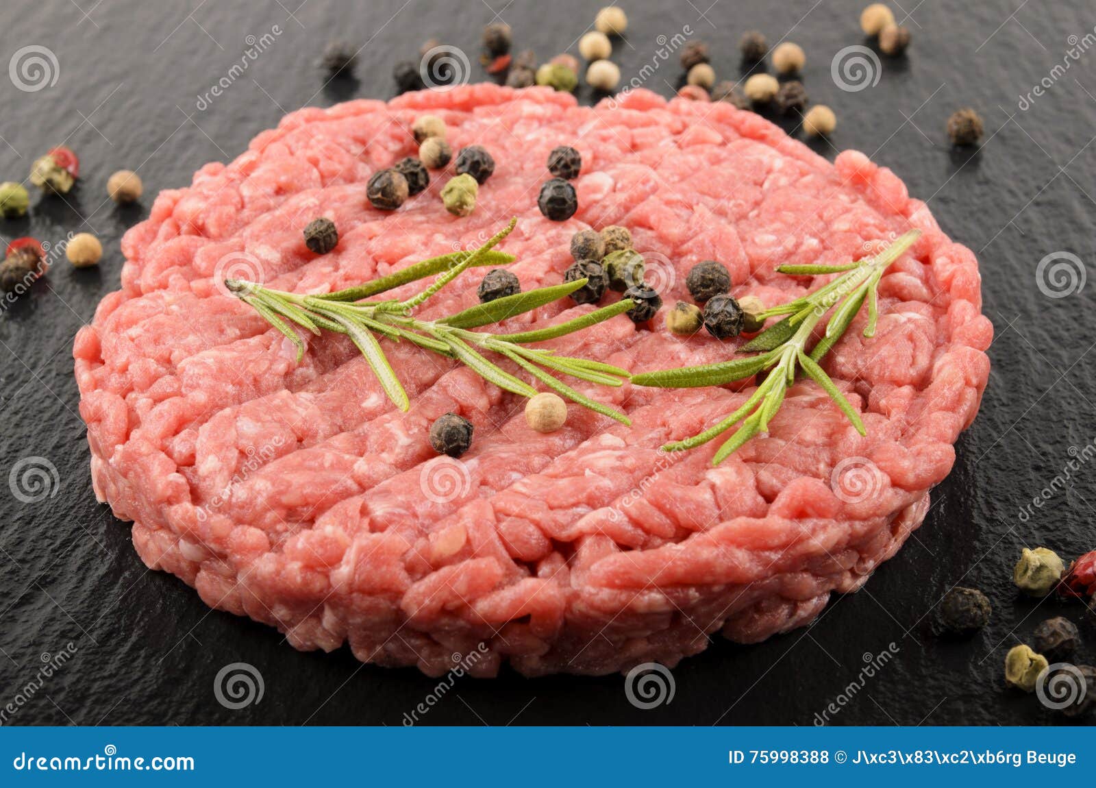 raw premium aberdeen angus burger on wet slate