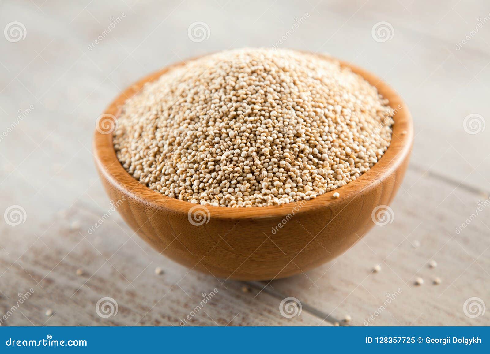 Raw quinoa seeds in a bowl stock image. Image of diet 128357725