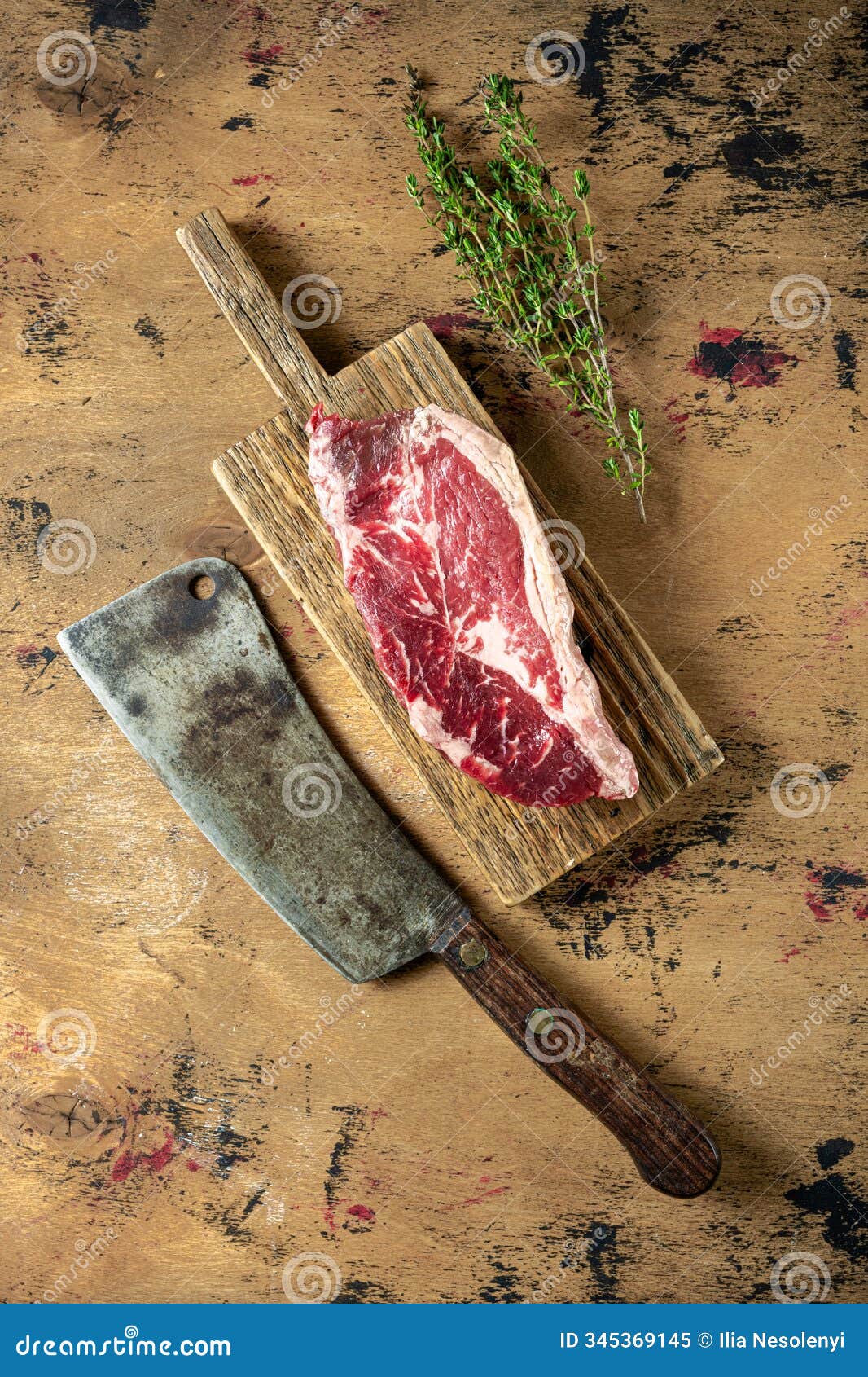 a raw ribeye steak rests on a wooden cutting board alongside a vintage cleaver, complemented by sprigs of fresh thy