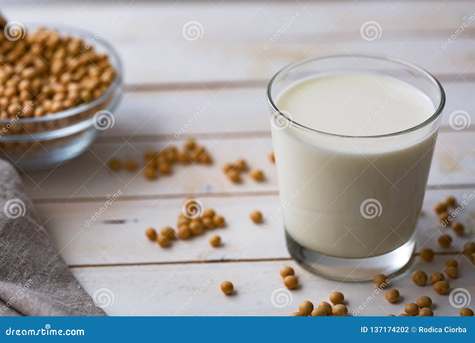 Raw Soy Seeds And Glass Of Milk On Slate Background ...