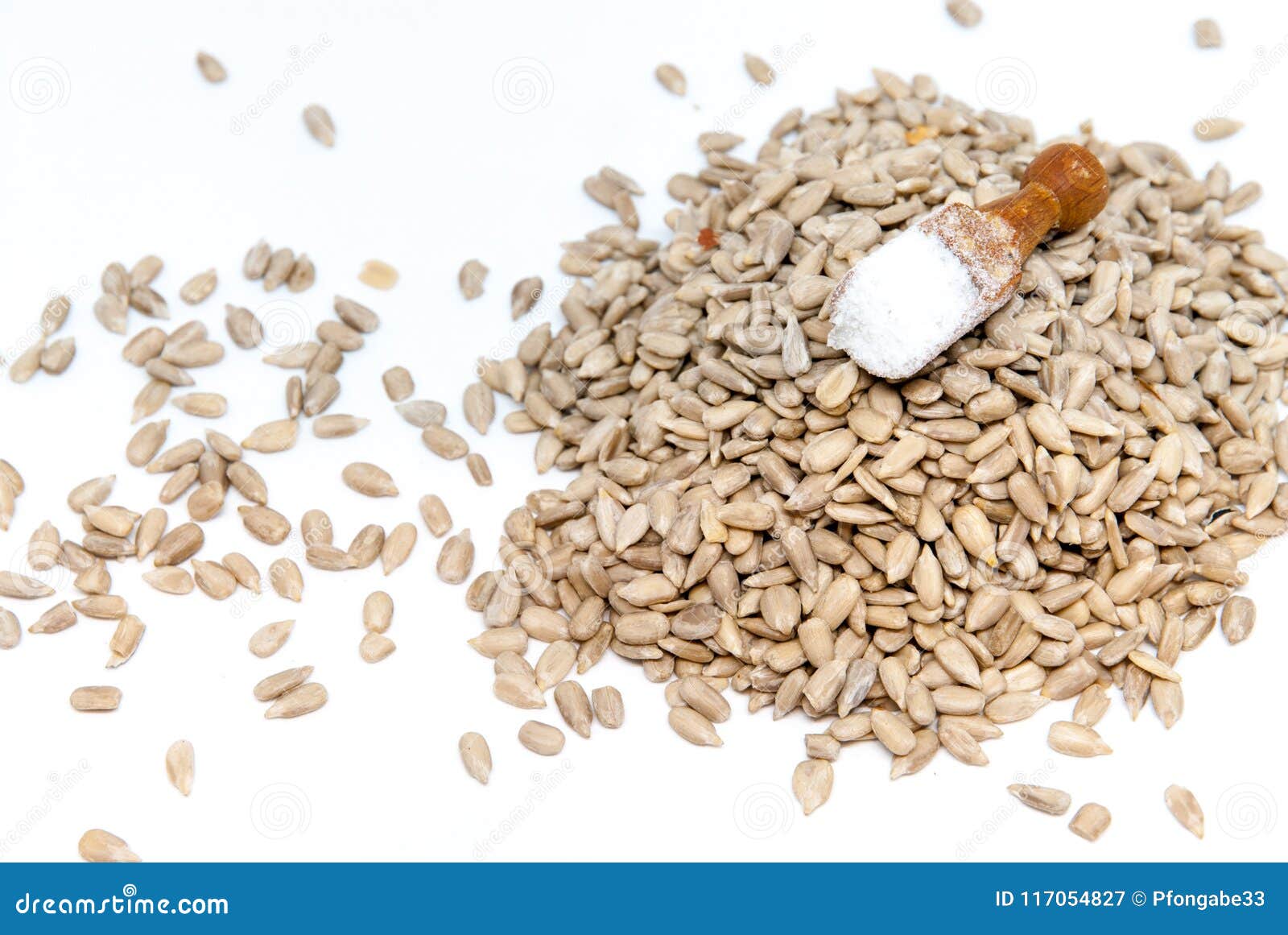 Raw Sunflower Peeled Kernels Spread on White and a Touch of Salt Stock