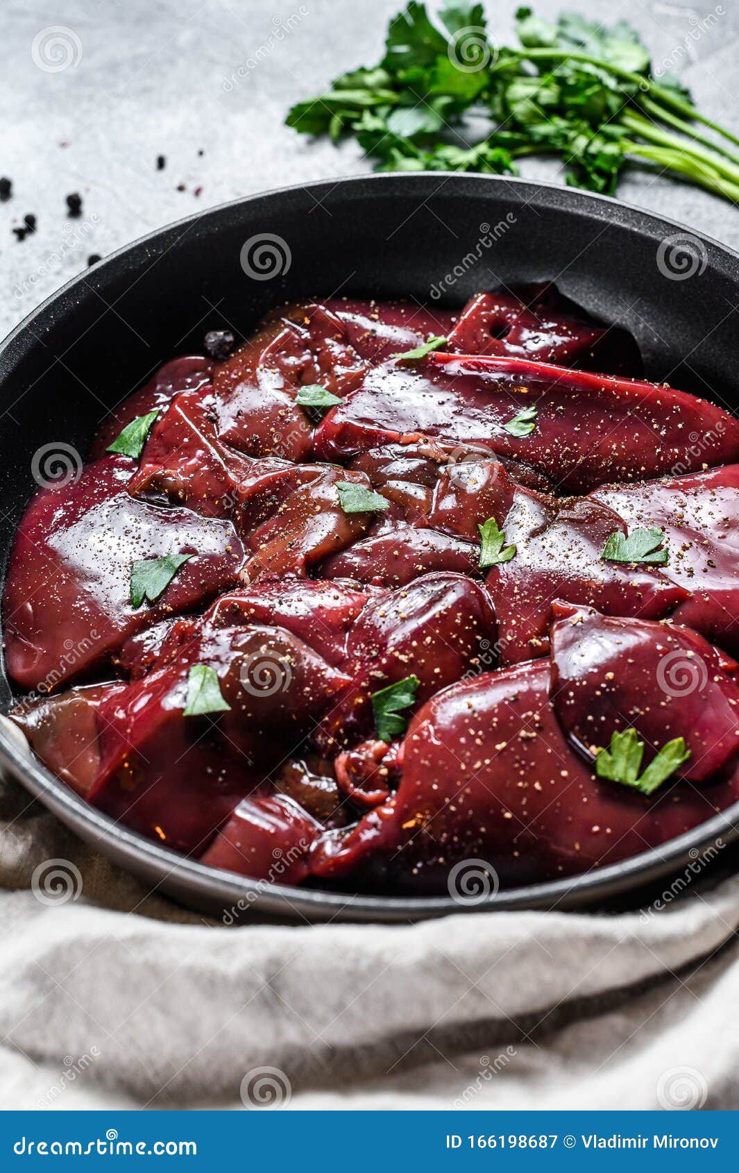 Raw Turkey Liver in a Frying Pan. Gray Background. Top View Stock Image