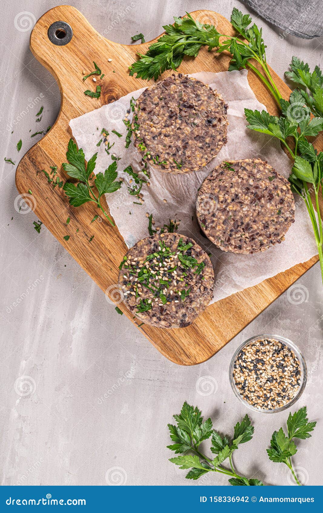 Raw Veggie Burger With Black Beans On Wood Countertop Stock Photo