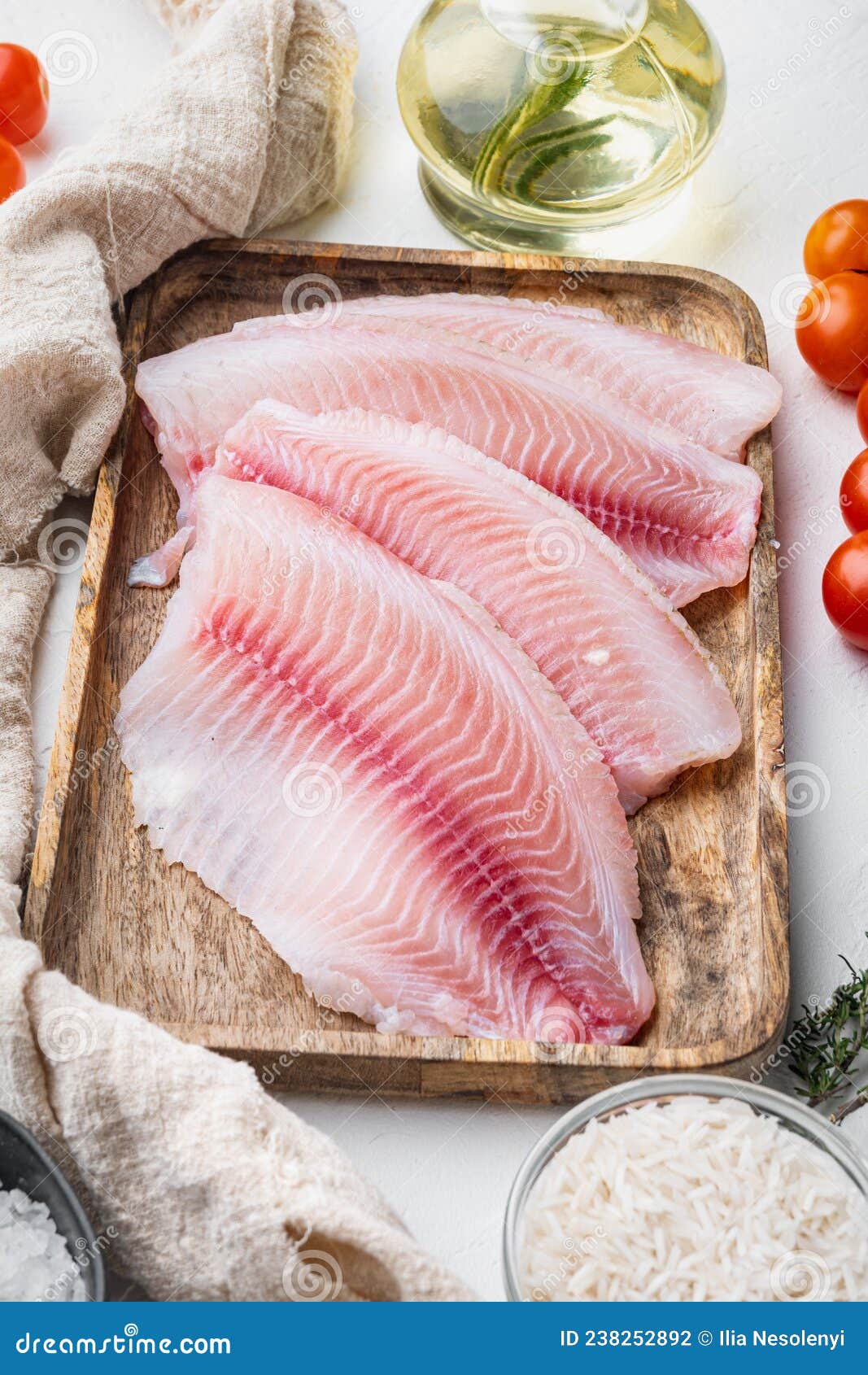 Raw White Fish Tilapia with Basmati Rice and Cherry Tomatoes