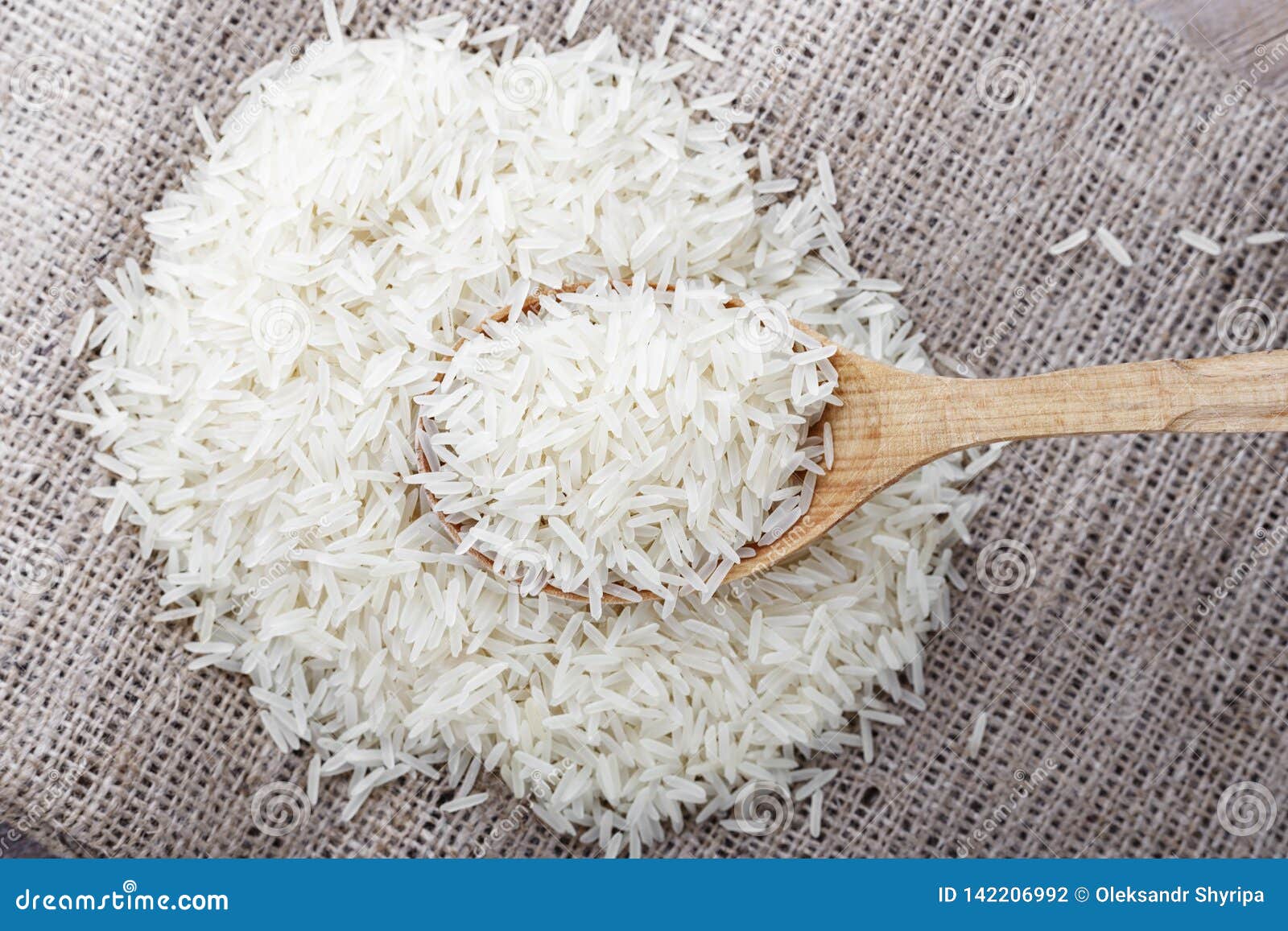 Raw white rice in a spoon stock photo. Image of culture 142206992