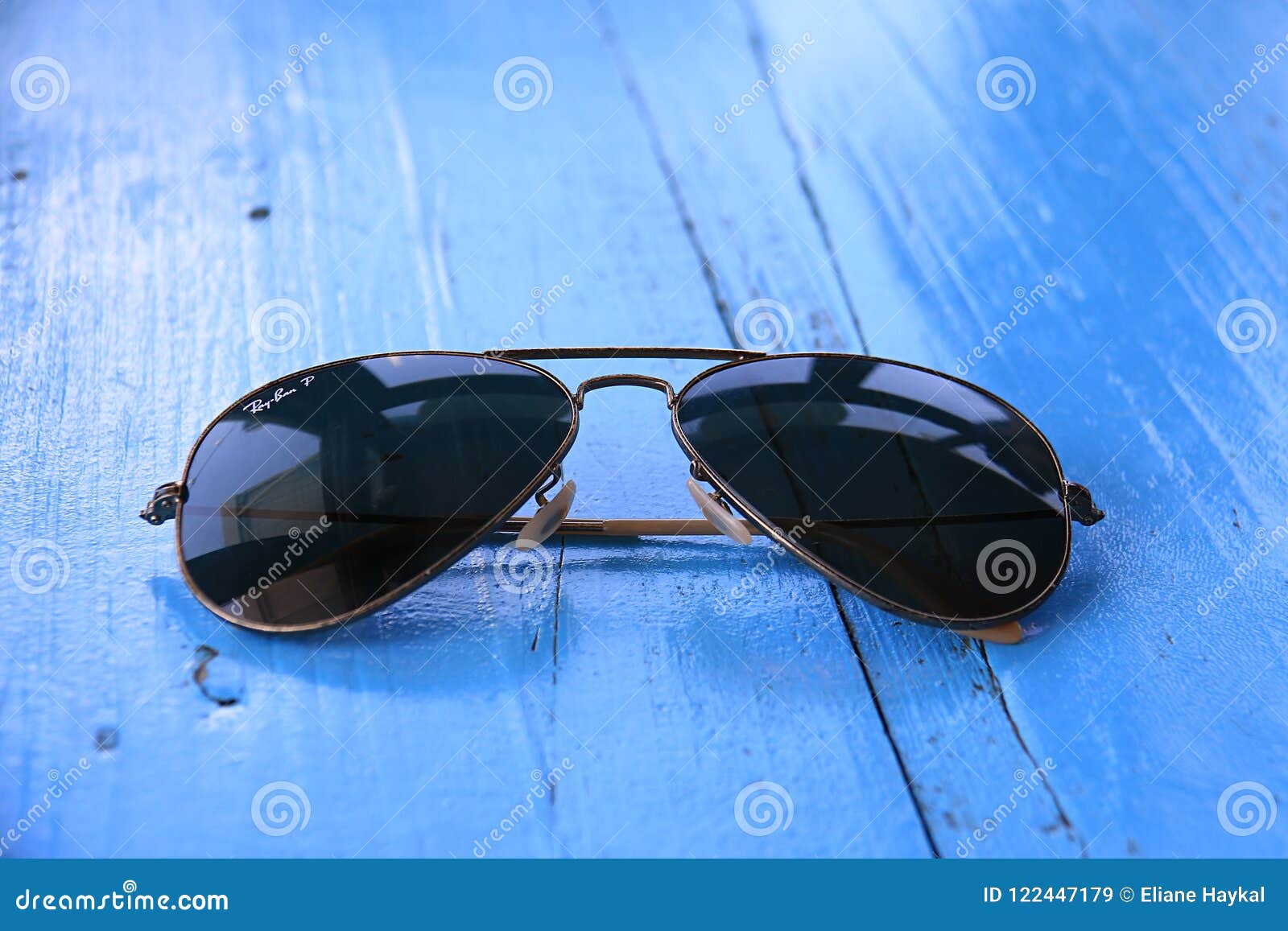 Ray-Ban Sunglasses on Blue Table Editorial Stock Image - Image of july,  1937: 122447179