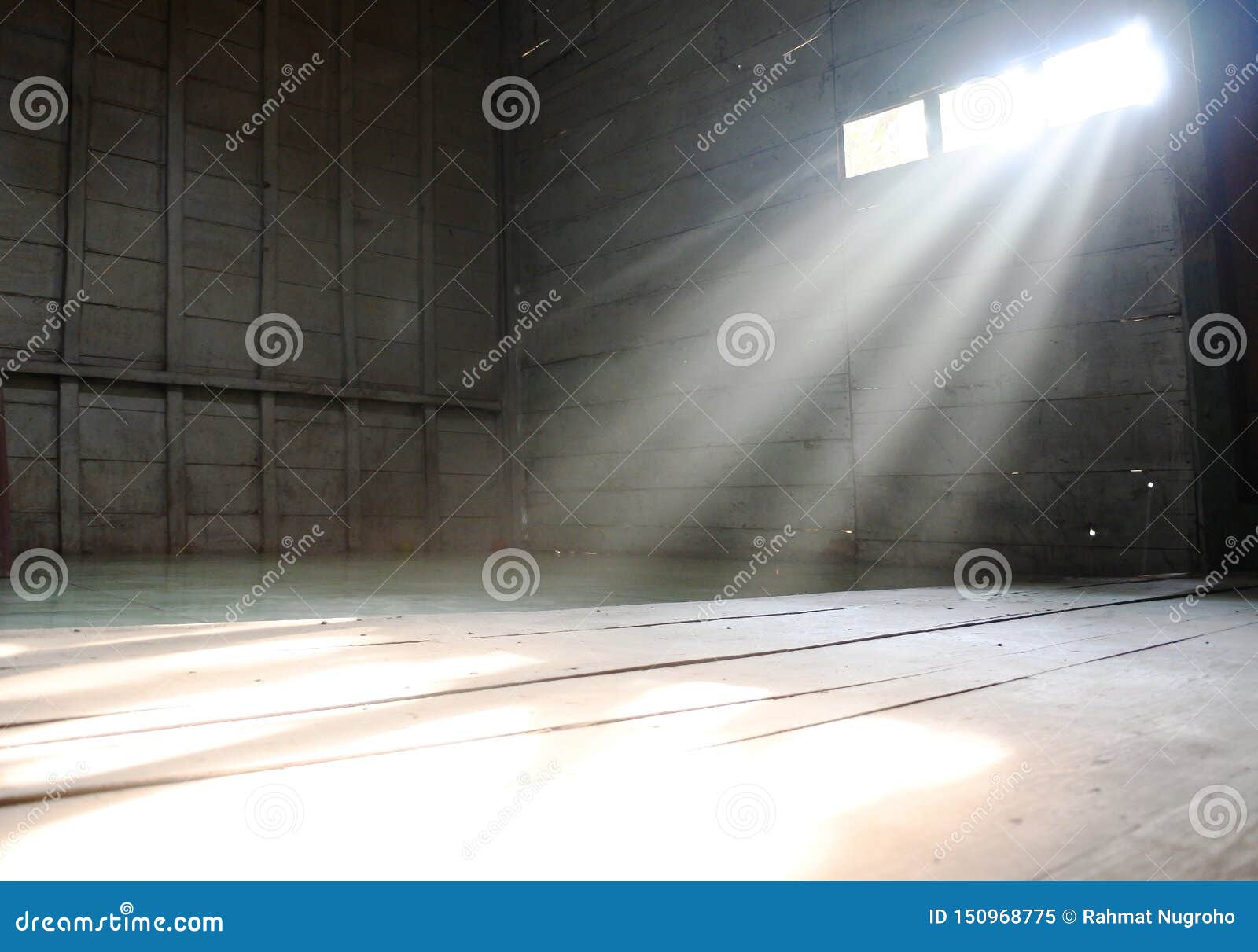 ray of light pierces the window of the house