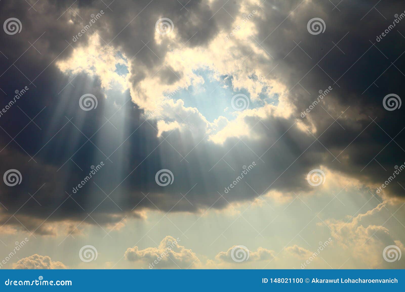 ray of sun light shine through the gap among cloud for hope and optimism concept