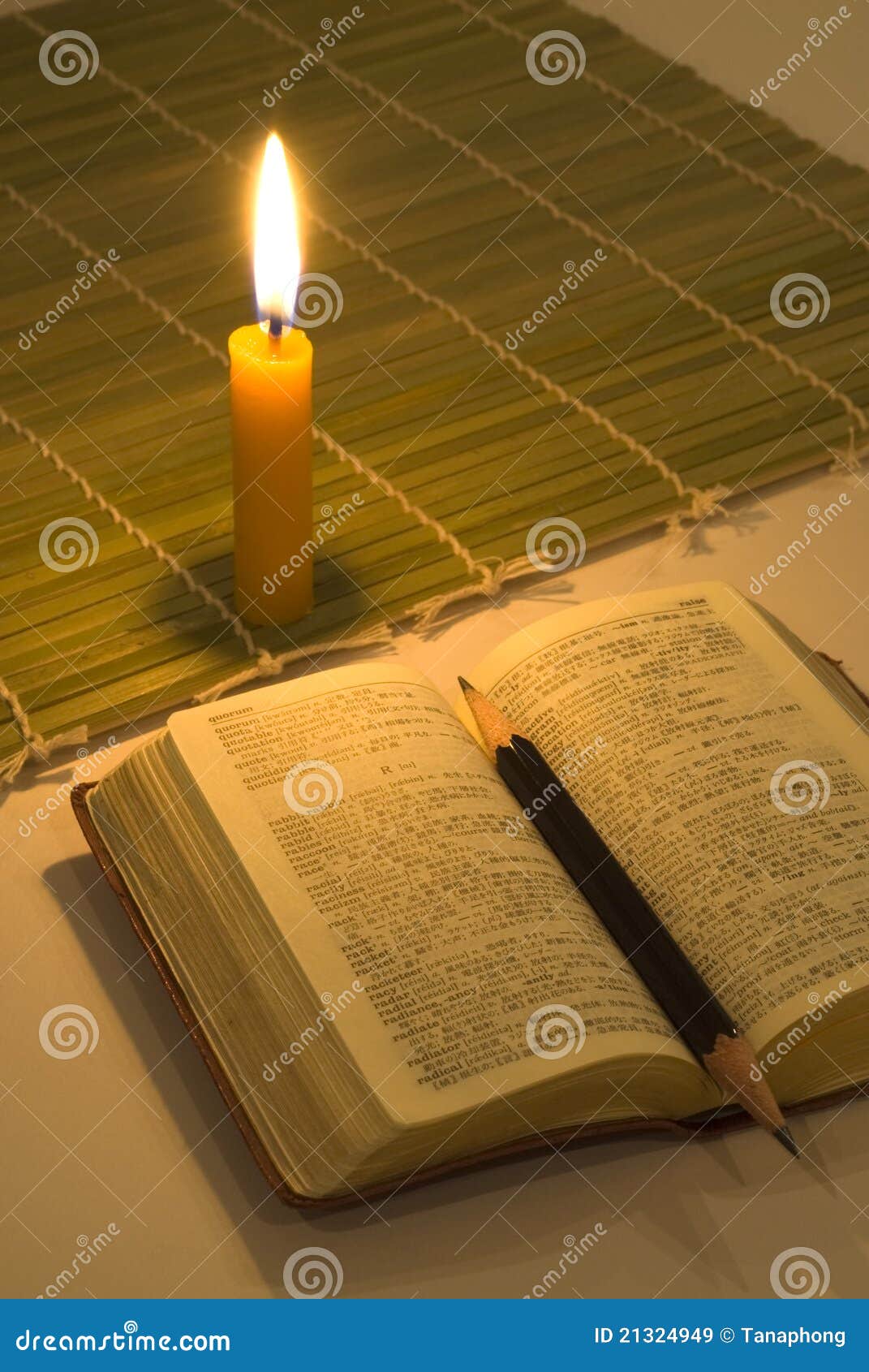 Reading book with candle stock image. Image of faith 21324949