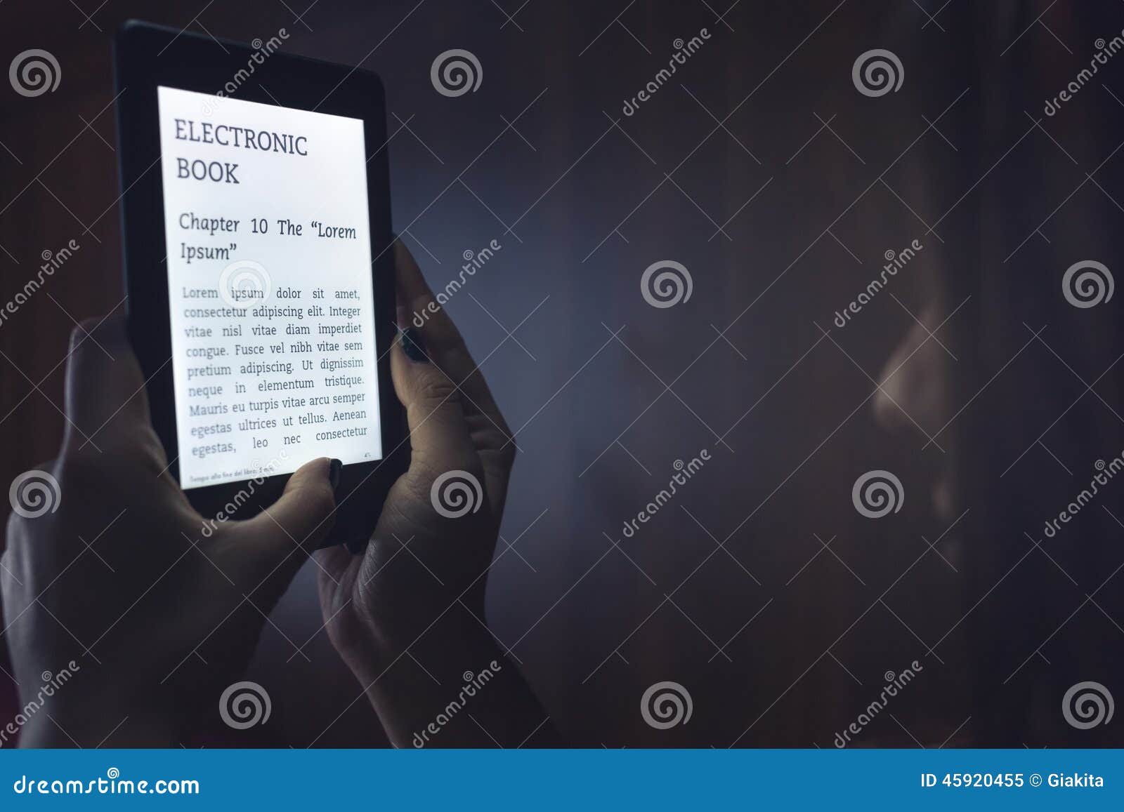 Reading an ebook in bed stock image. Image of comfortable 45920455