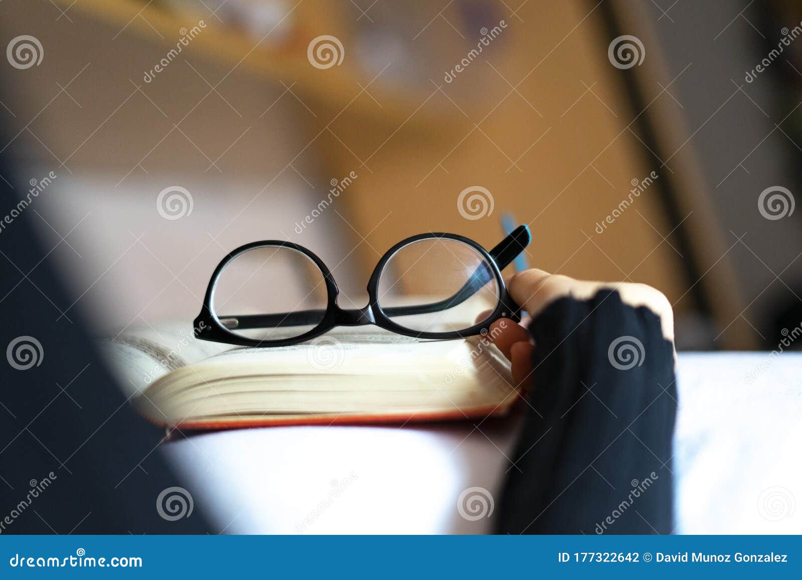 reading glasses on top of a book