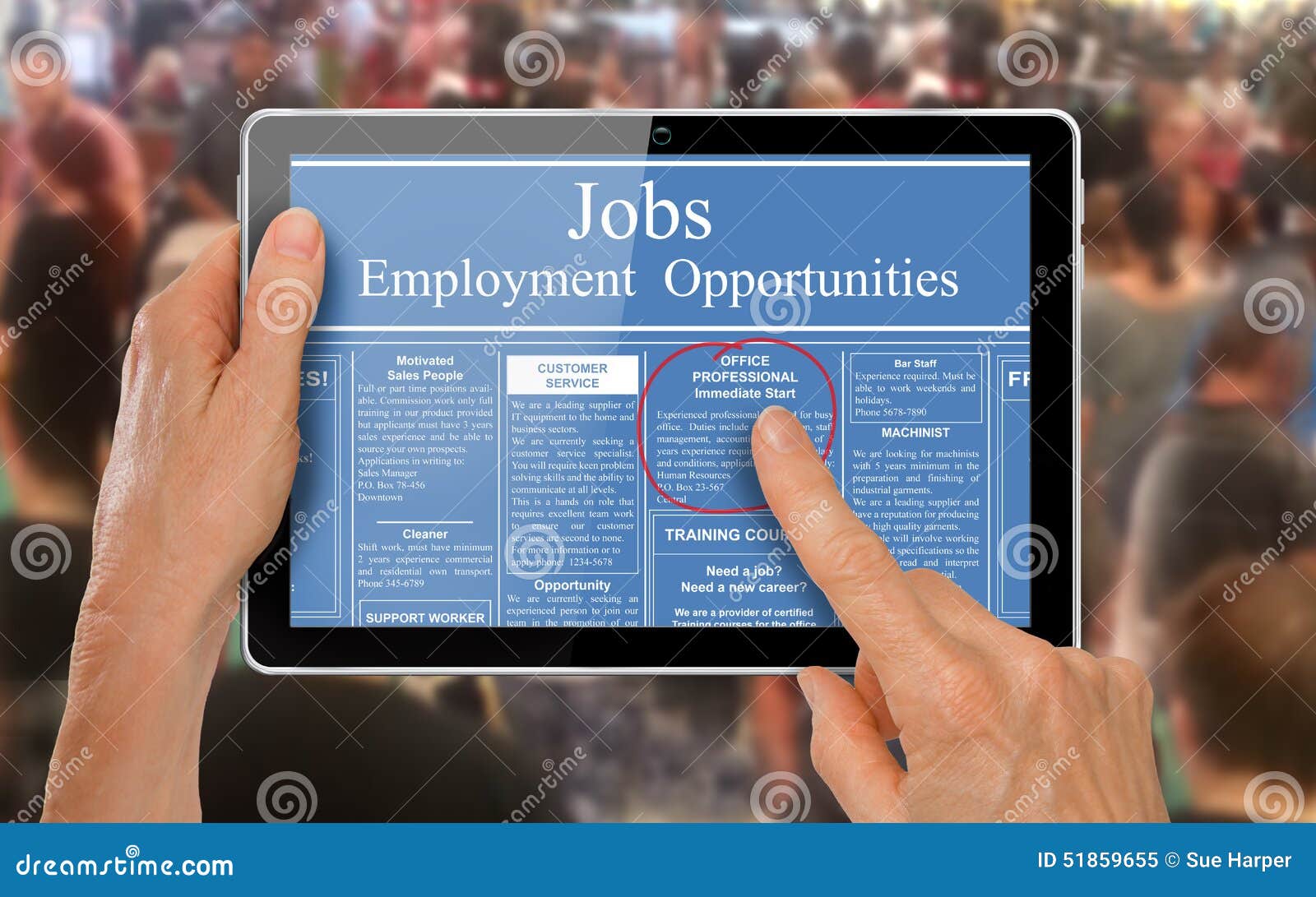 reading online job ads on a computer tablet -