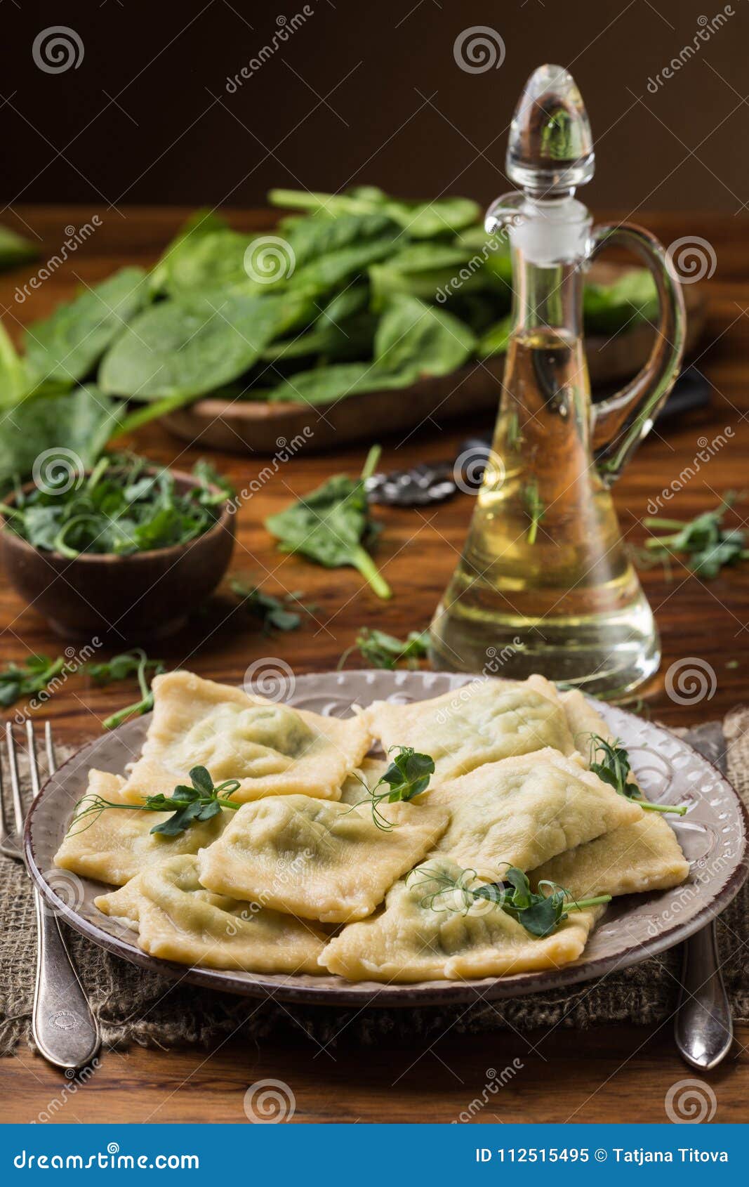 Ready Ravioli in a Plate, Spinach, Olive Oil in a Jar Stock Image