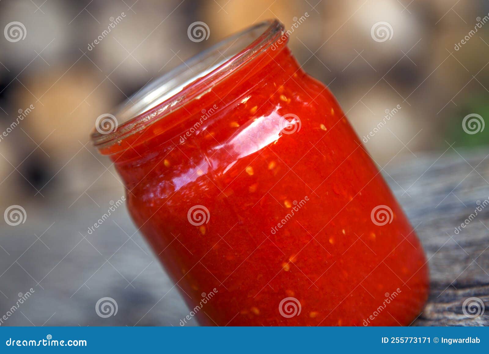 Ready Tomato Paste in a Jar on the Table. Tomato Ketchup Sauce in a