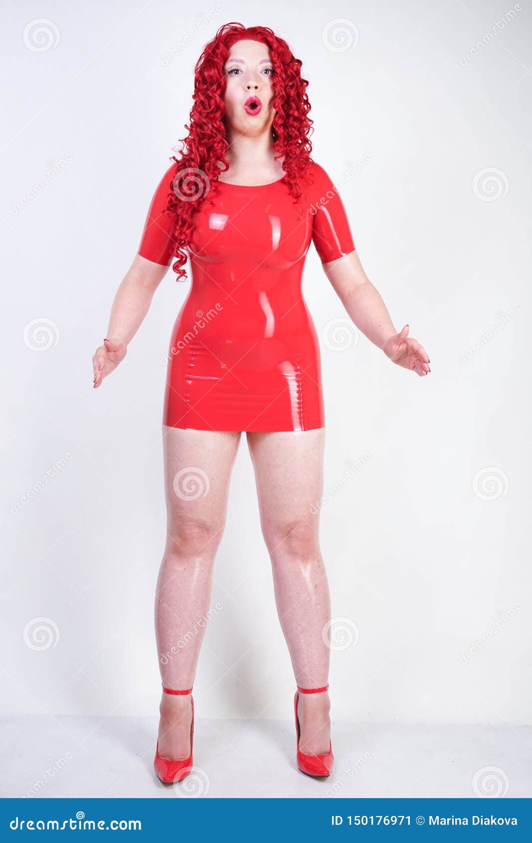 landen Triatleet Losjes Real Doll Woman Wearing Red Latex Rubber Dress and Posing on White Studio  Background Alone. Curvy Plus Size Adult Girl Standing As Stock Image -  Image of life, doll: 150176971