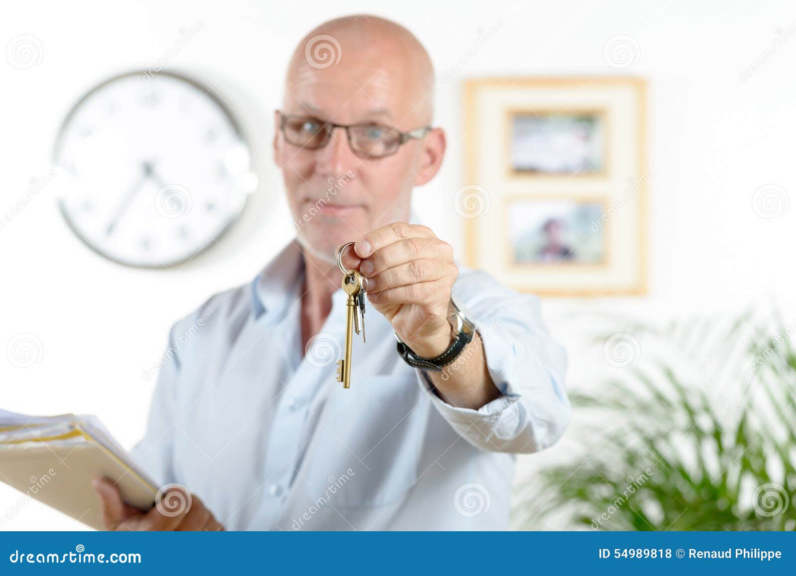 Real Estate Agent Gives the Keys of the House Stock Photo Image of