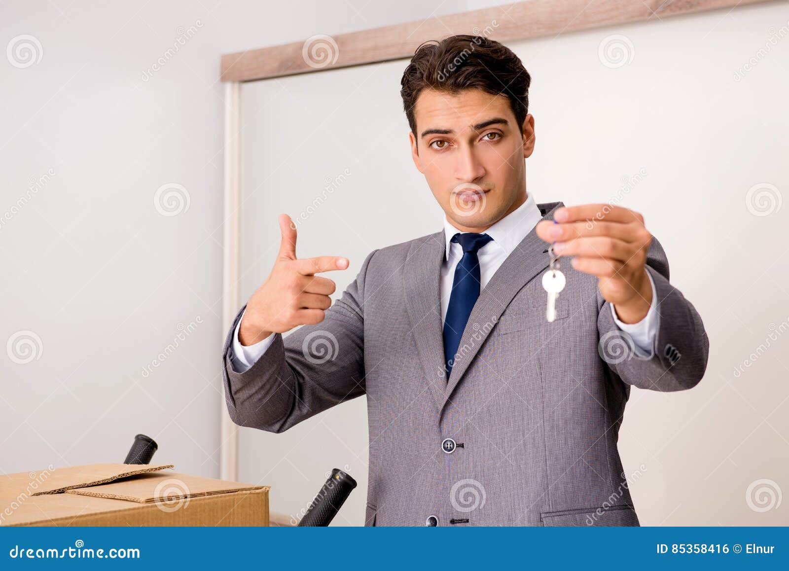 The Real Estate Agent with Key from New House Stock Photo Image of