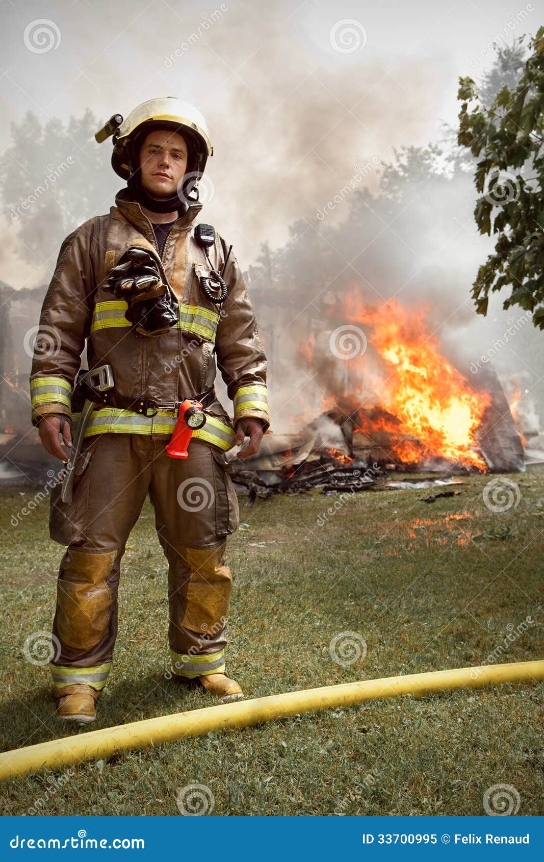 Real Firefighter With House On Fire In Background Royalty ...