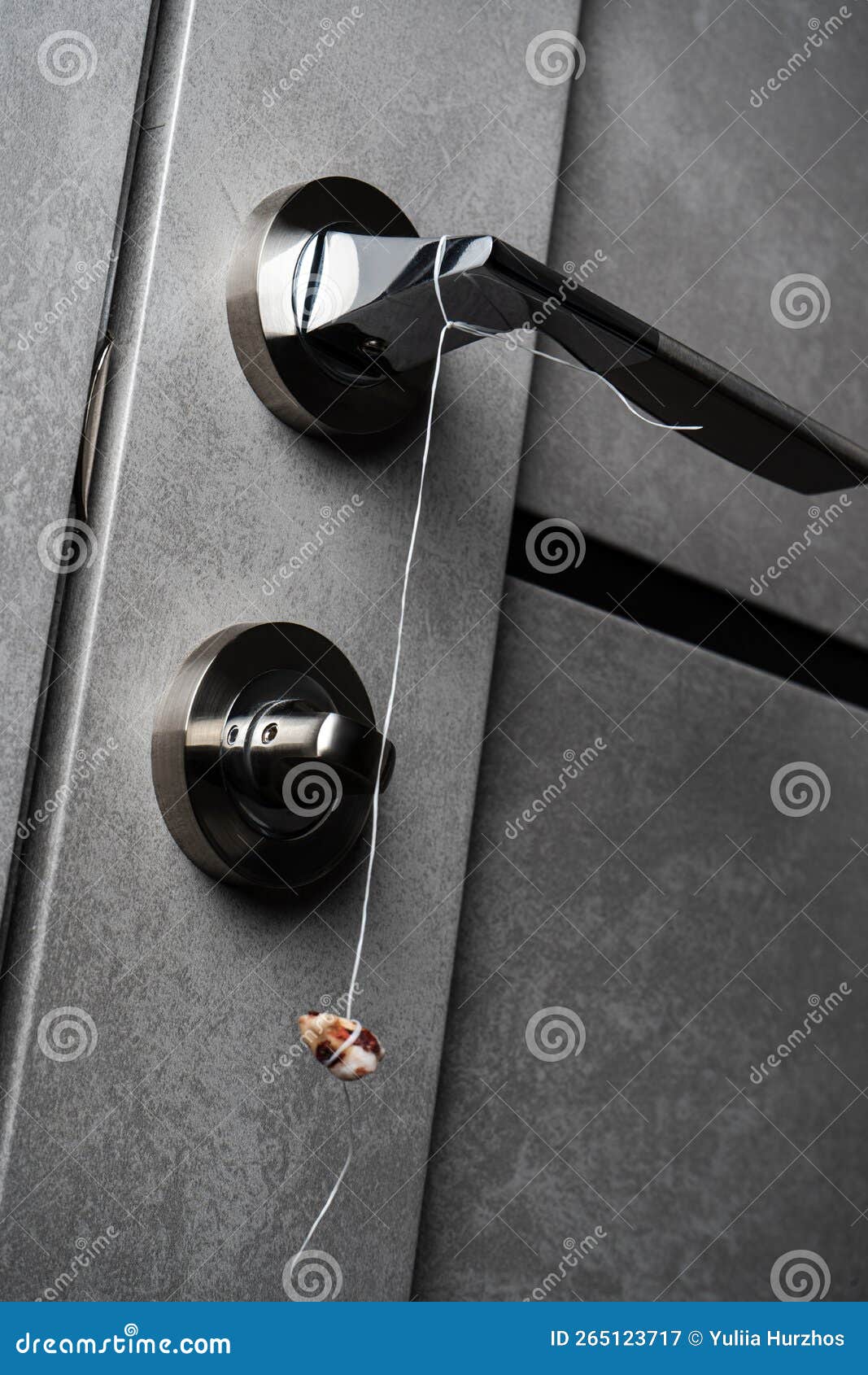 Real Human Teeth Hanging on the Door Handle. Pulled Out Tooth