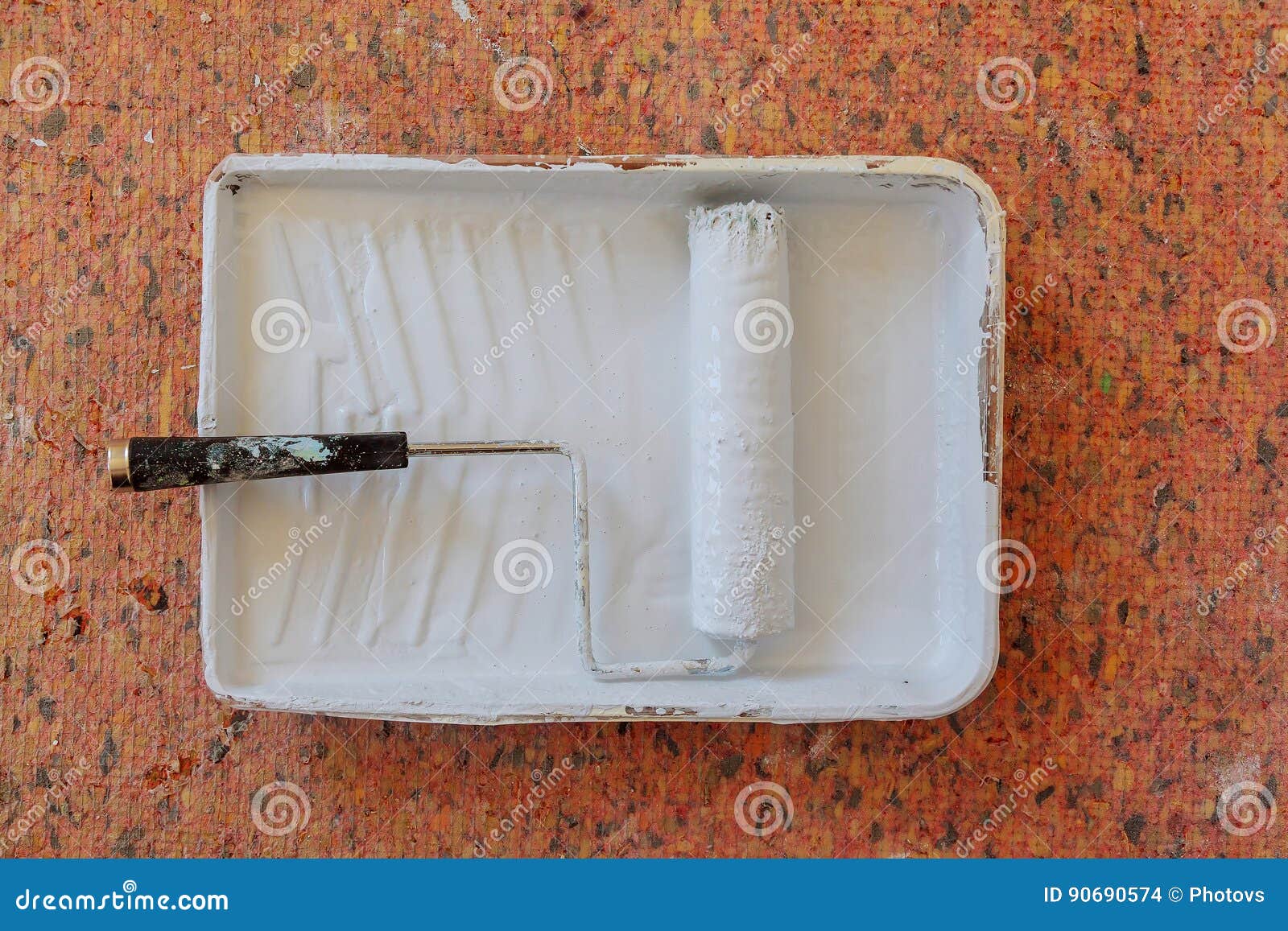 Realistic Image of Paint Pan and Roller on Drop Cloth during Painting