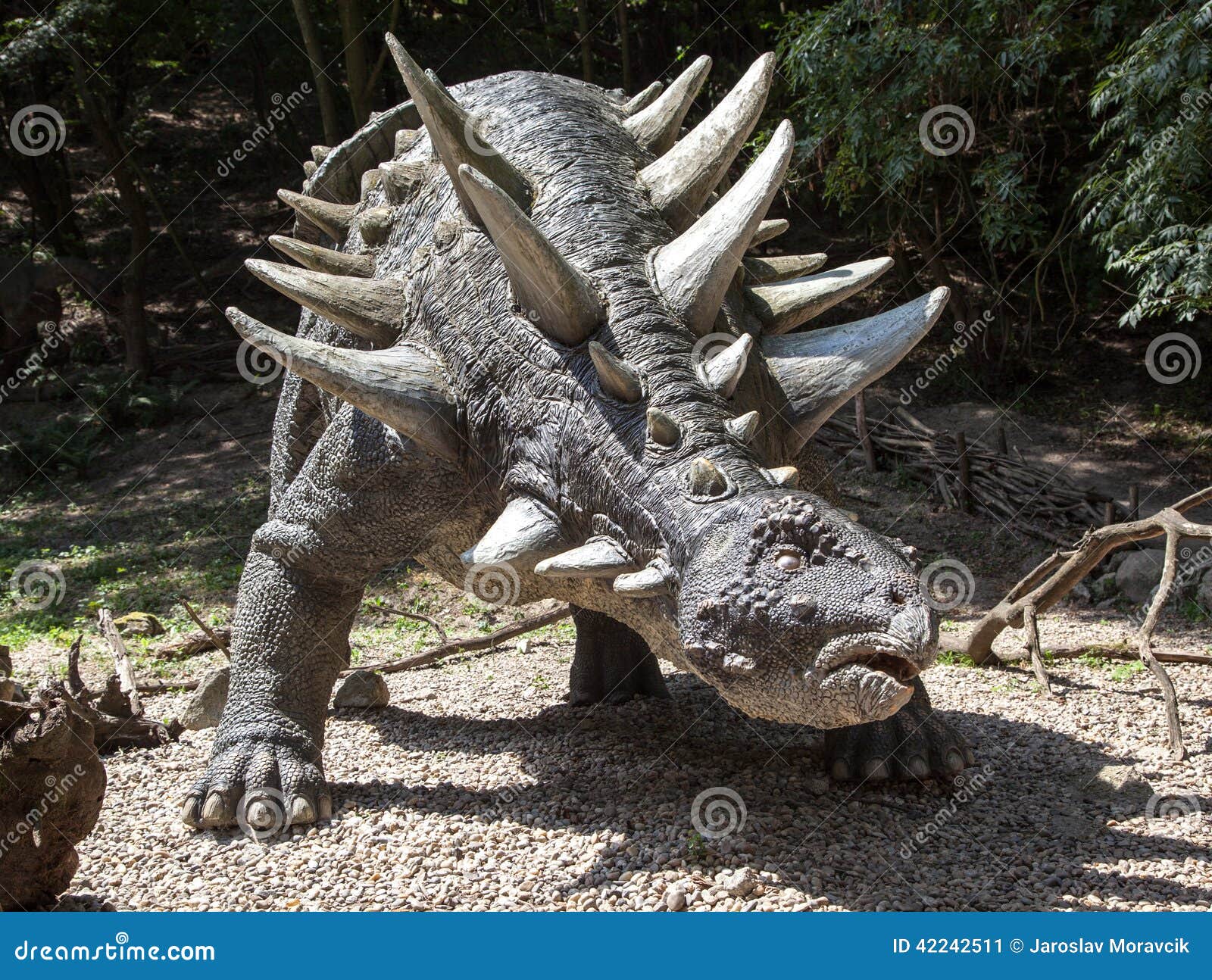 Realistic Model Of A Tyrannosaur In The Original Growth. Park With