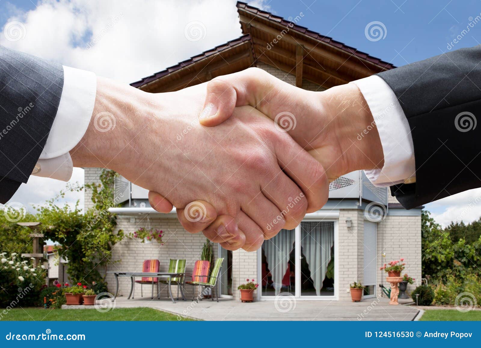 realtor shaking hands with client after selling house