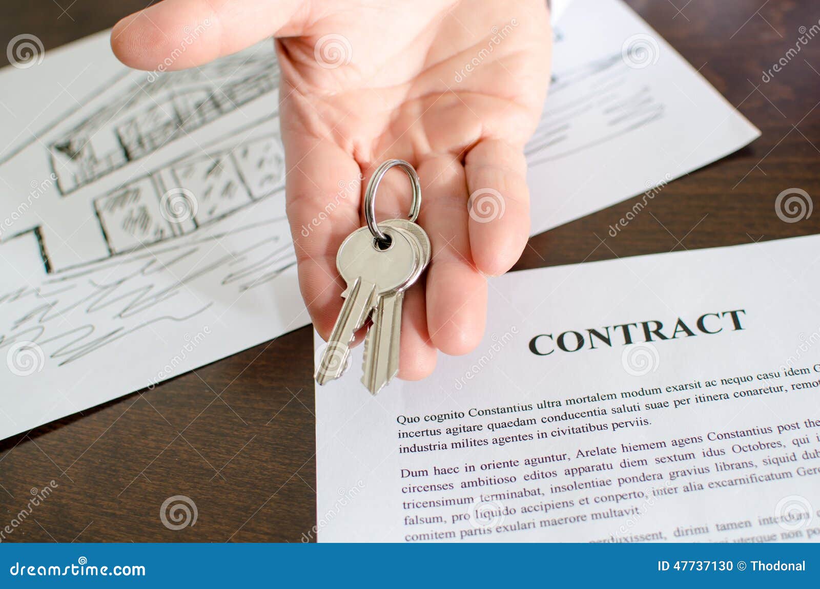 Realtor showing house keys stock photo. Image of purchase 47737130