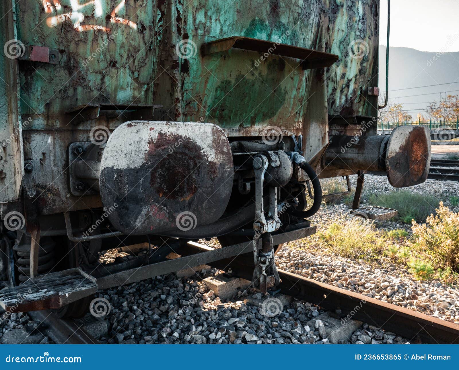 rear part of a freight wagon with its buffers and hooks waiting to be hooked up to the rest of the railway vehicles