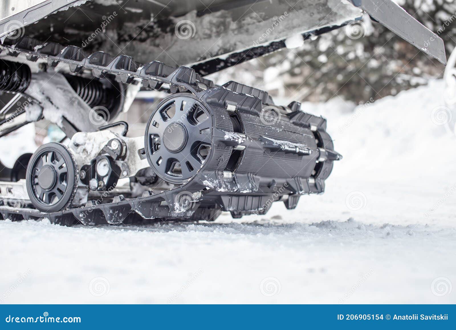 Rear Suspension of a Snowmobile in Winter. Riding on a Snowmobile Stock