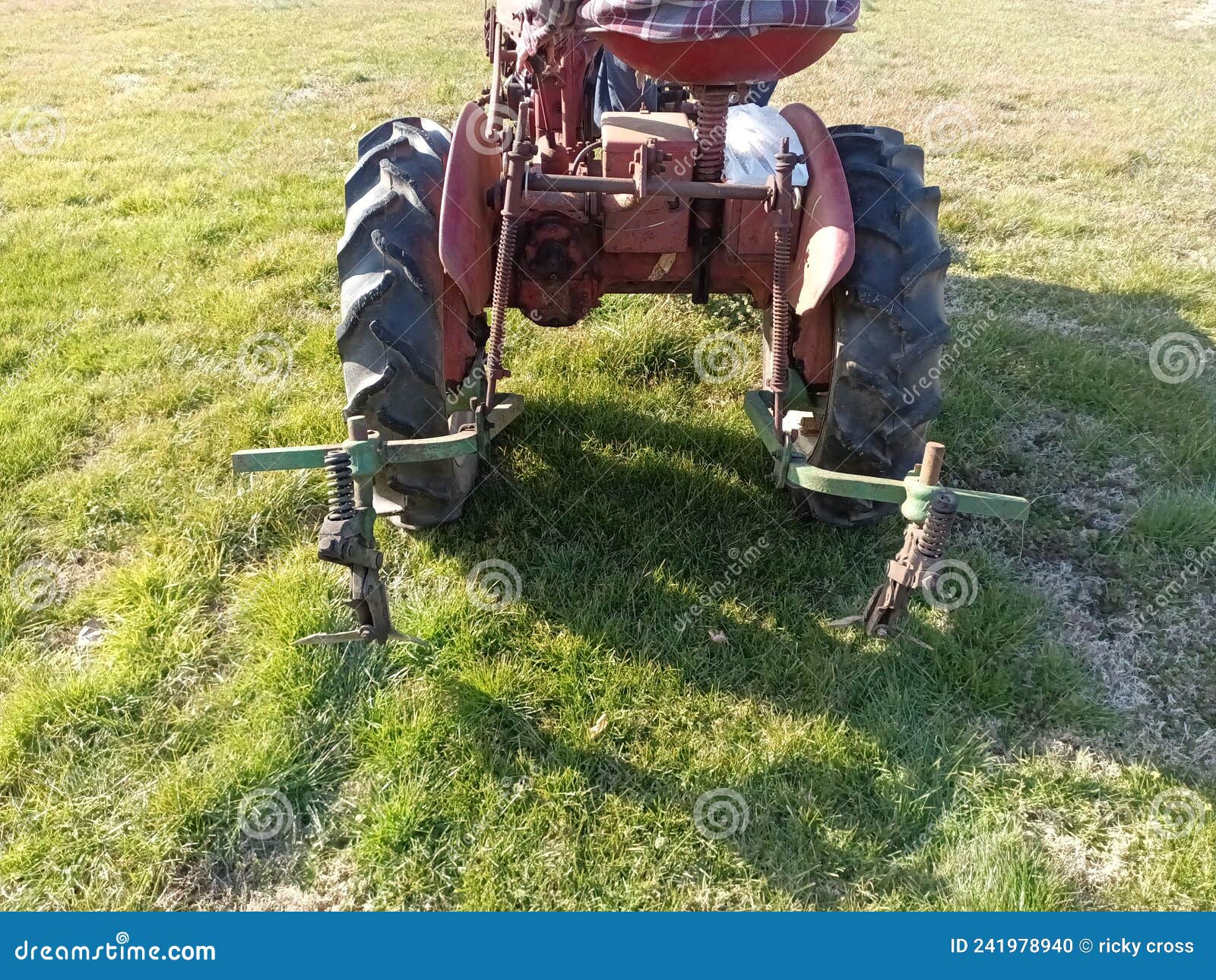 This is the Rear of the Tractor Stock Photo Image of grass, crop