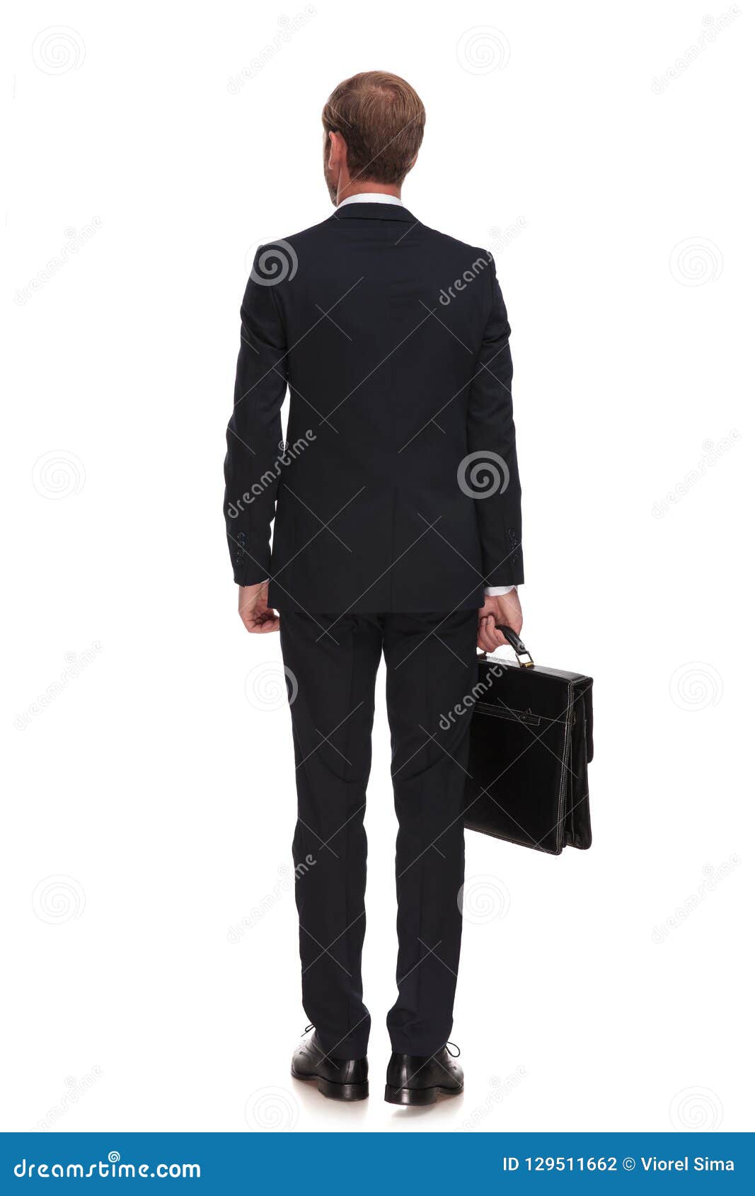 Rear View of Businessman in Suit Holding Suitcase and Standing Stock ...