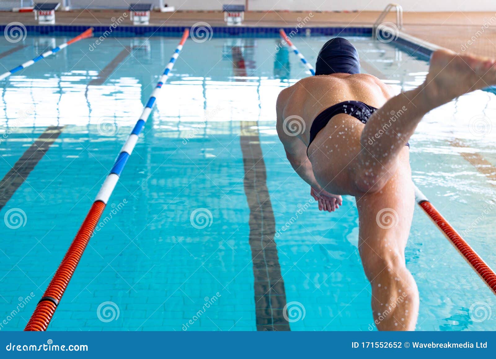 swimmer plunging in the pool