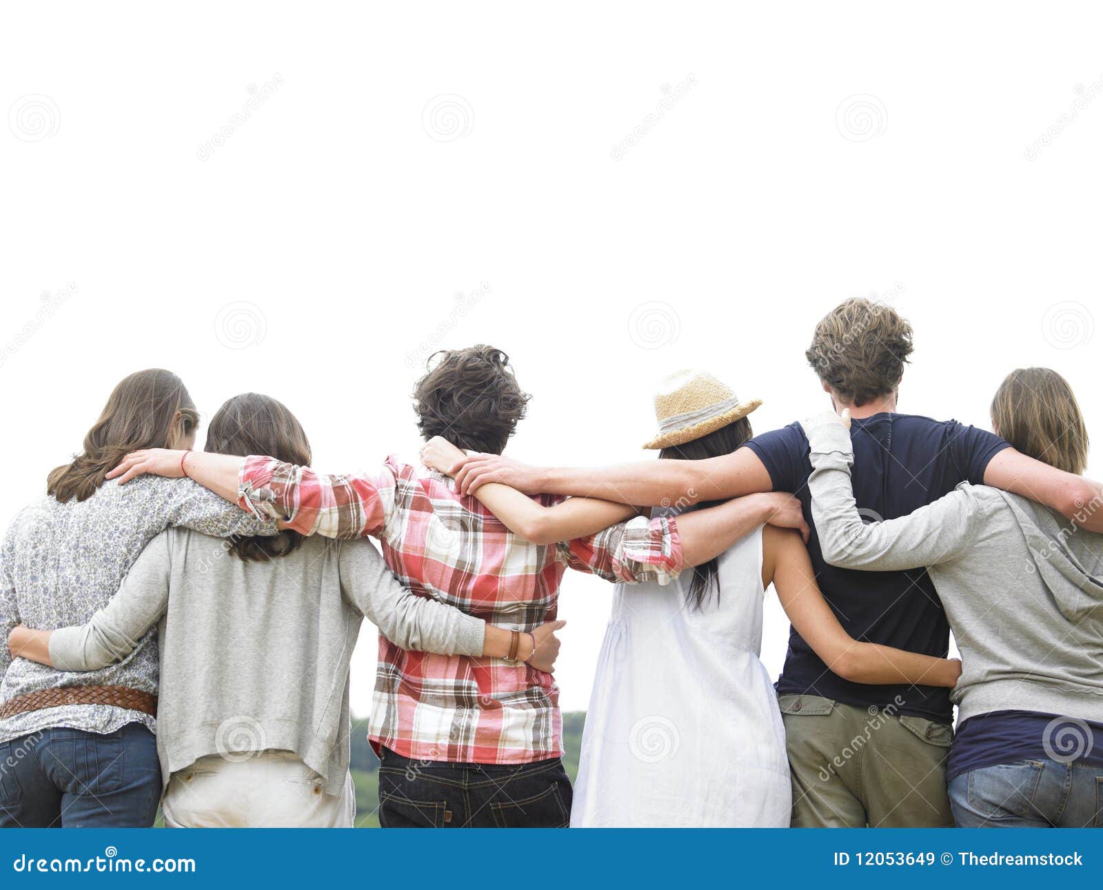 rear view of group of friends hugging