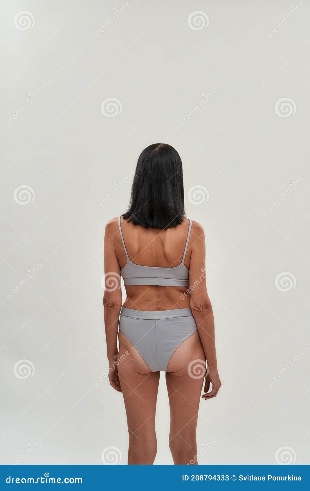 Young woman standing in top and underpants, hand pulling on underwear, rear  view - Stock Photo - Masterfile - Premium Royalty-Free, Code: 632-07161321