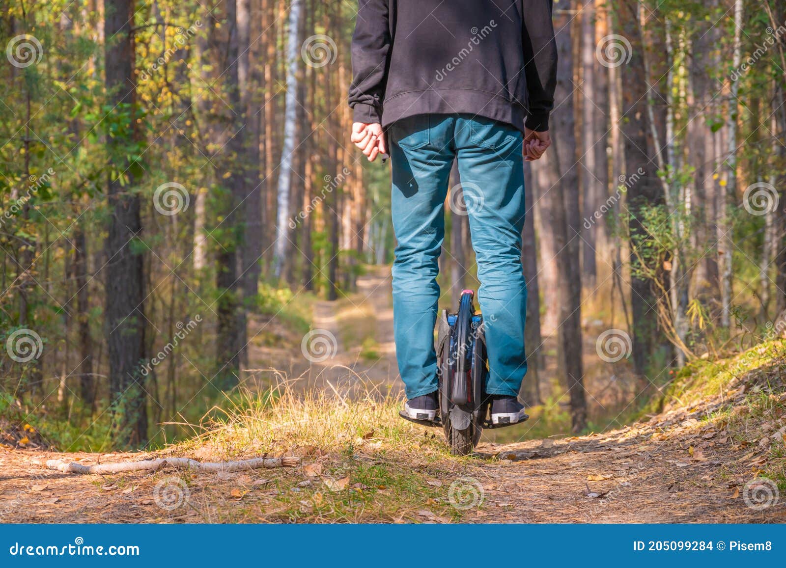 rear view of a man on an electric unicycle