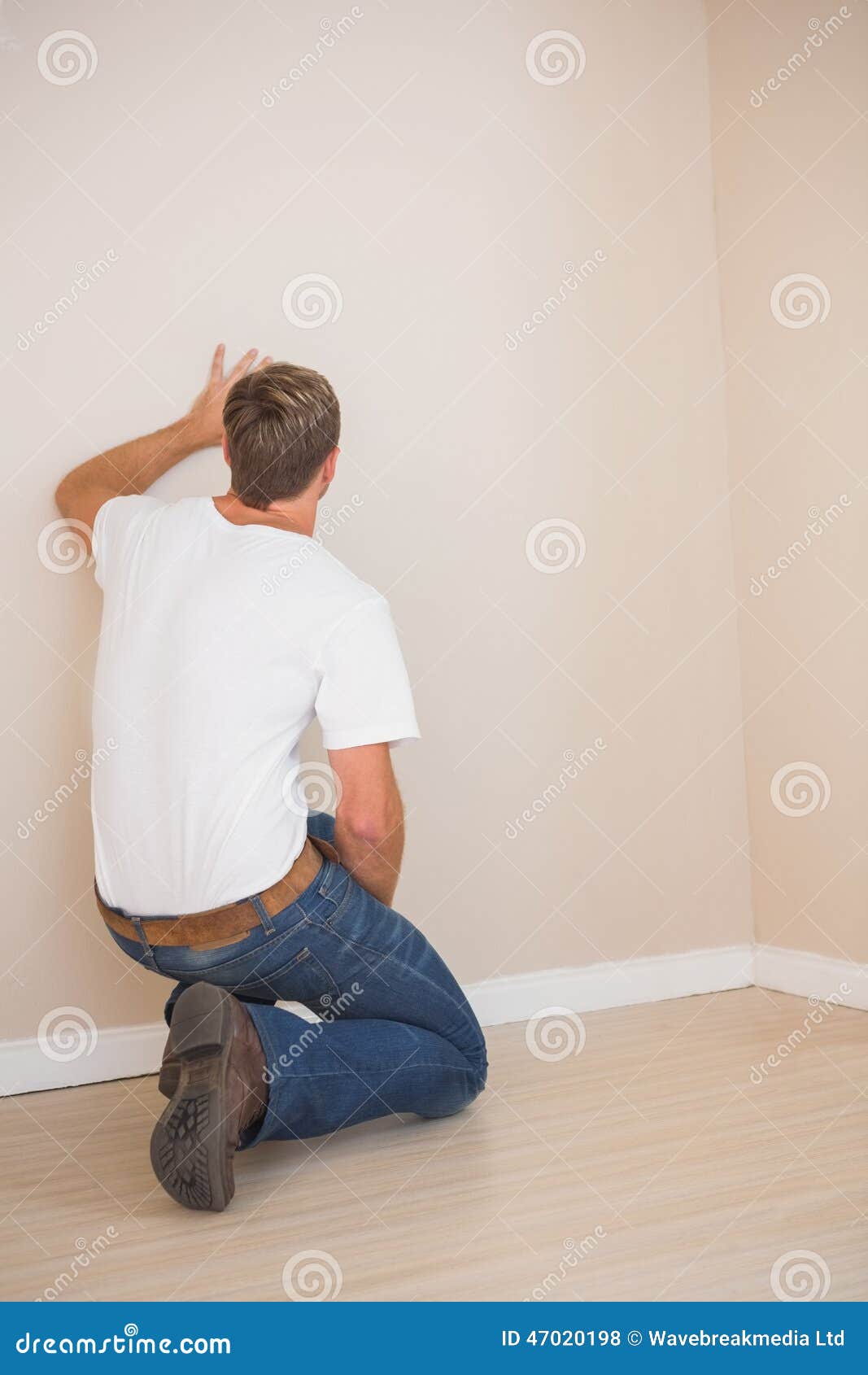 Rear View of a Man Looking at the Wall Stock Photo Image of home