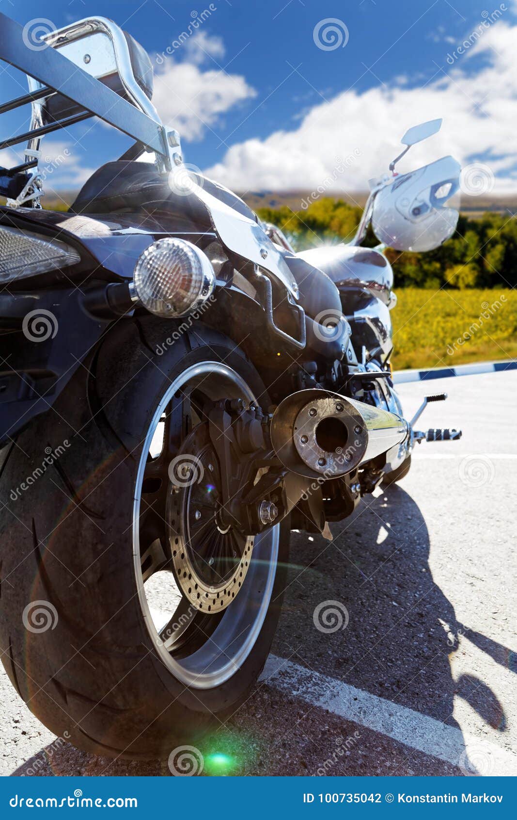 rear view on motorcicle against blue sky