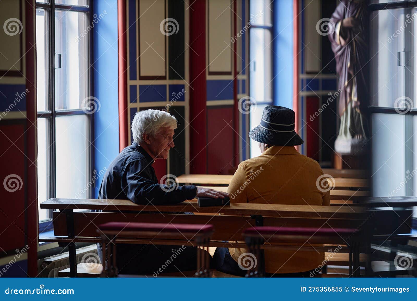 priest talking to visitor during ministration