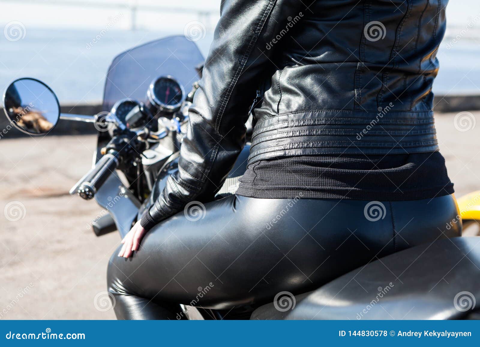 Download Rear View At Woman Sitting On Motorcycle In Black Leather ...