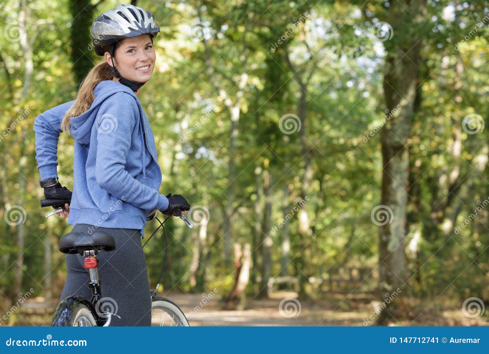 Download Rear View Sporty Female Rider Cycling Stock Image - Image ...