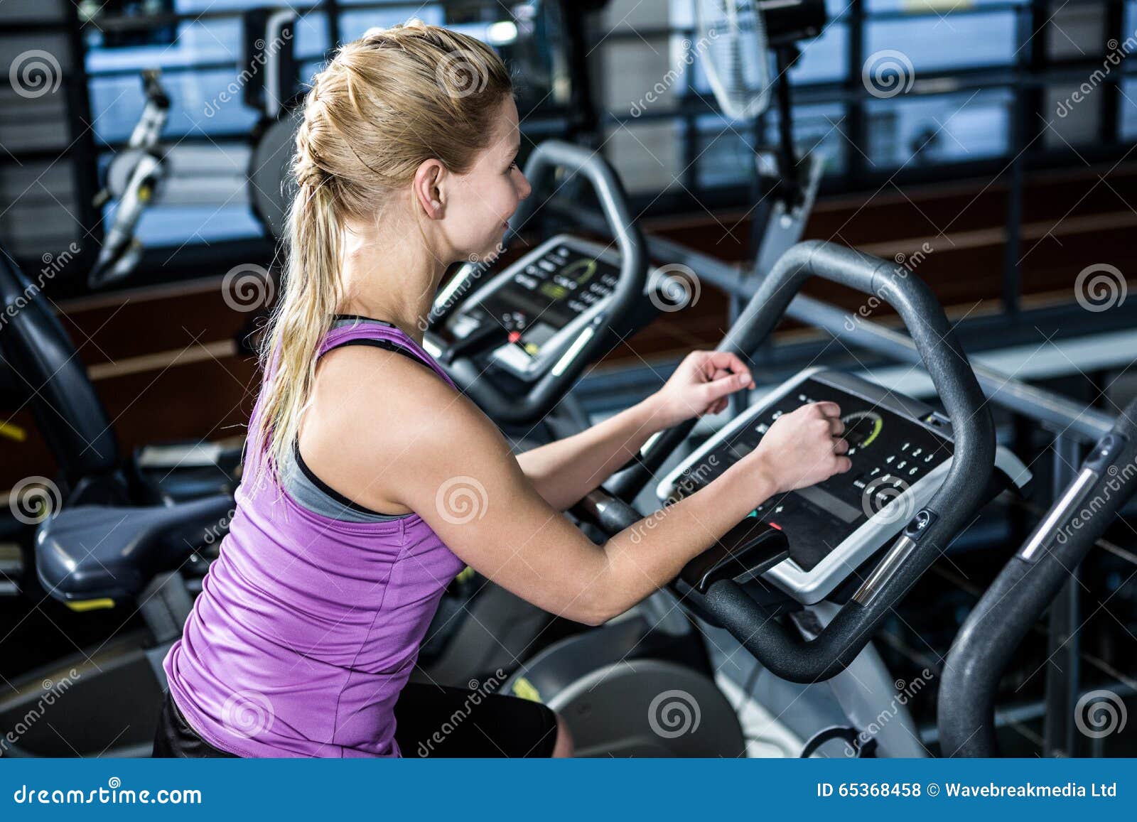 Download Rear View Of Woman Doing Bike Exercise Stock Photo - Image ...
