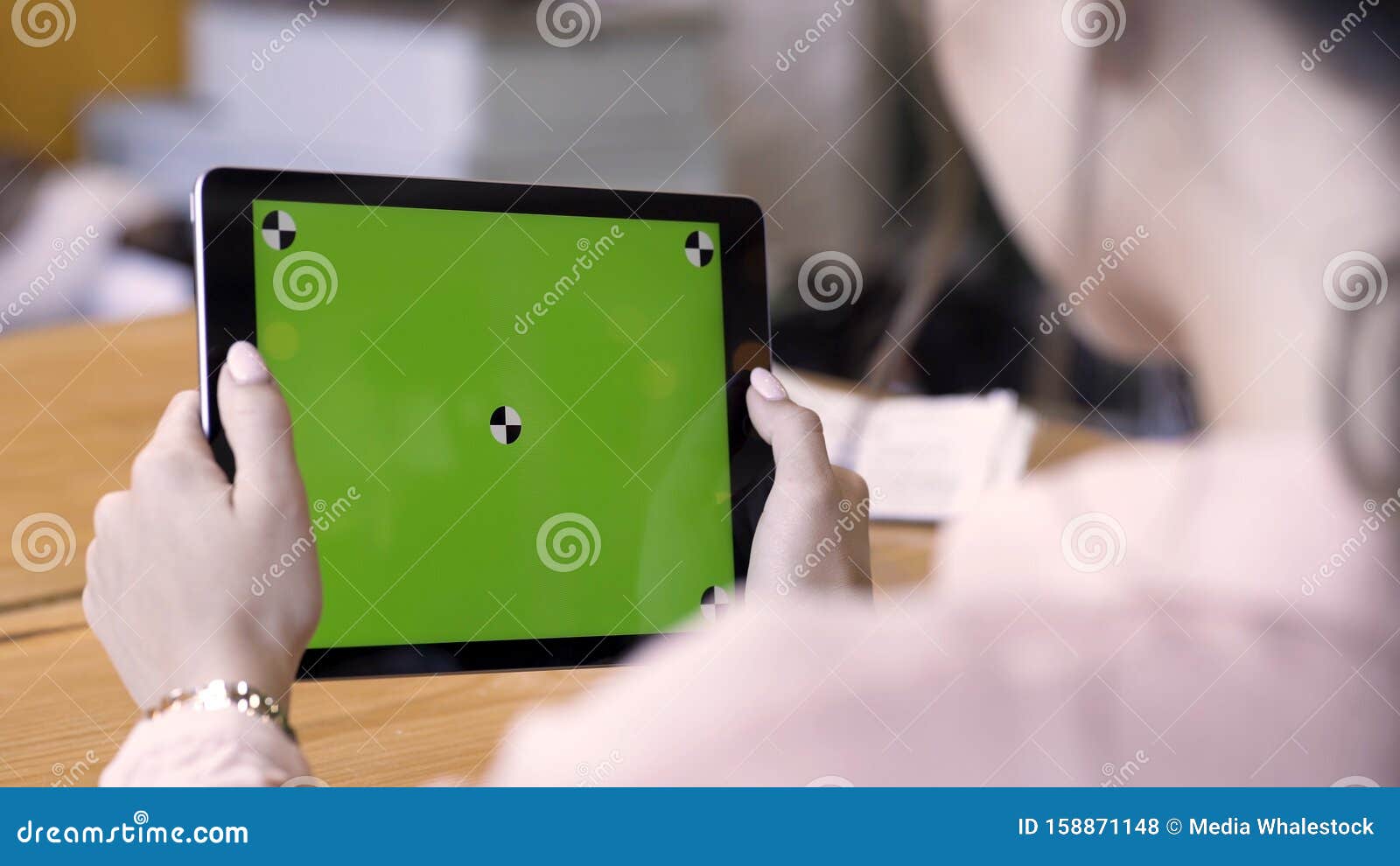 Rear View of a Woman Holding a Tablet with Chromakey with Tracking ...
