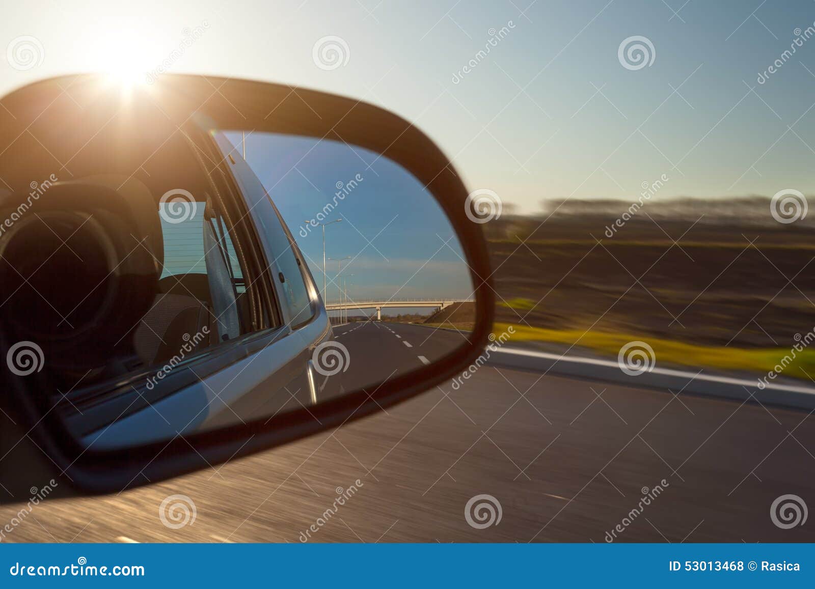 Rearview Mirror and the Setting Sun from Car Stock Photo Image of
