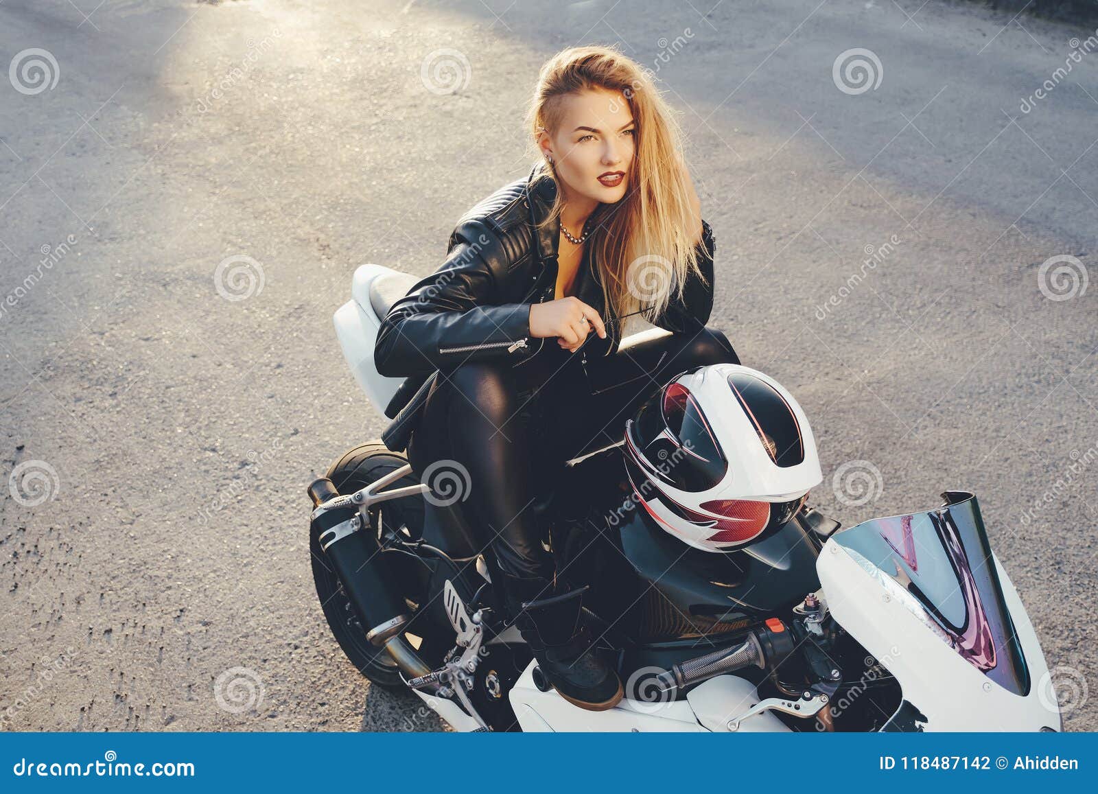 Young Beautiful Biker Woman Sitting on Motorbike Posing Stock Photo ...