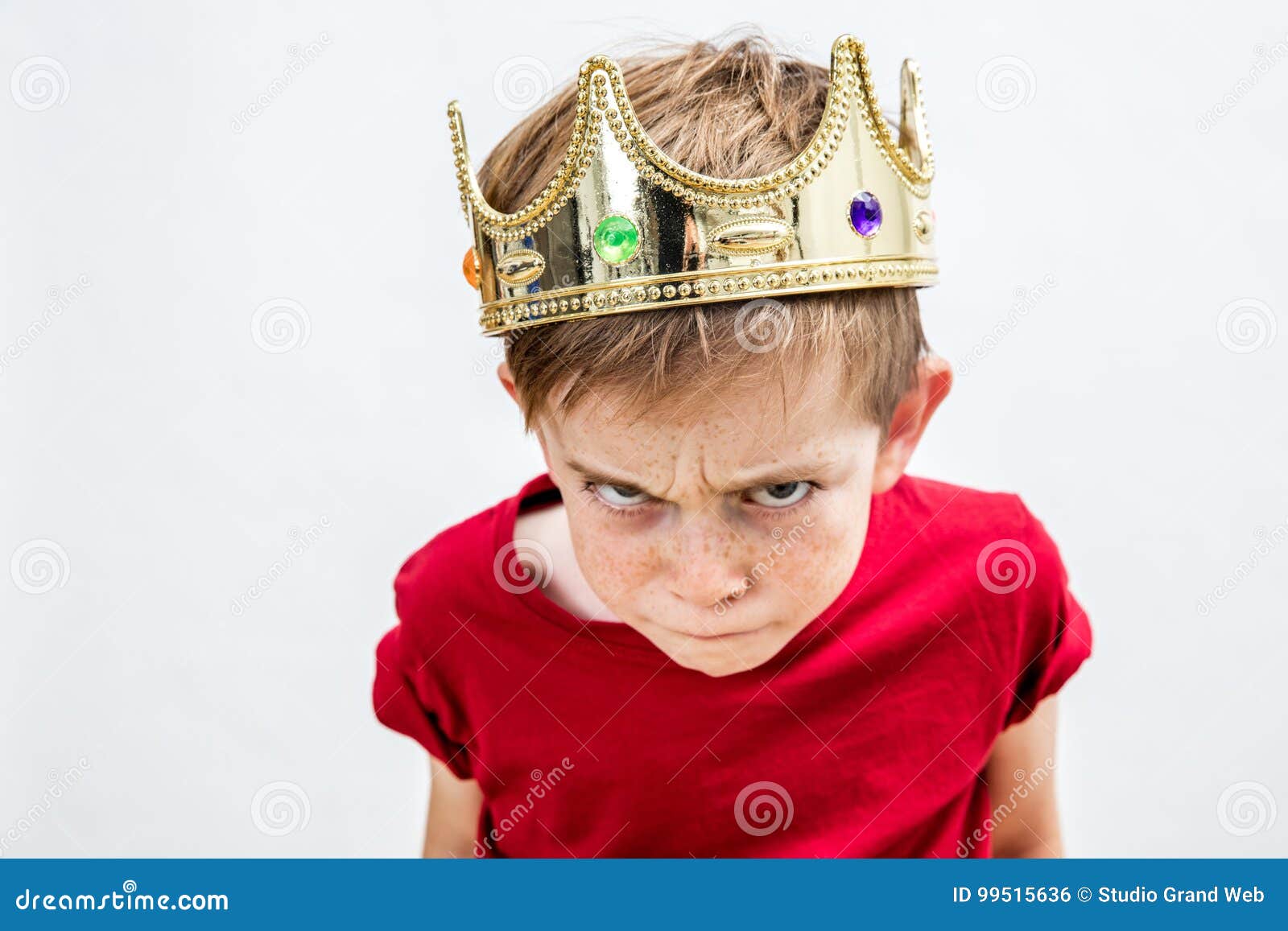 rebellious spoiled kid with crown for mad attitude, high angle